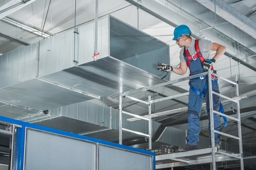 hvac-technician-testing-newly-installed-warehouse-2023-11-27-04-51-29-utc