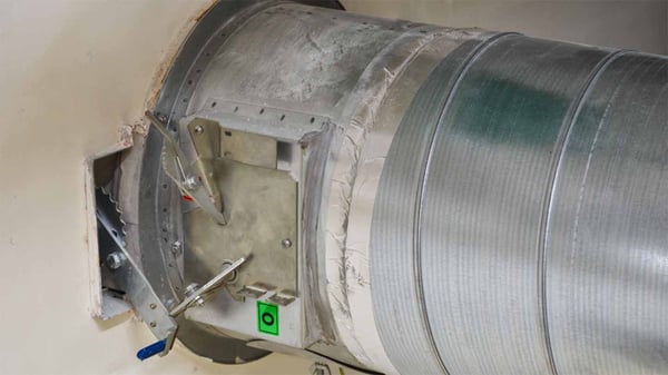 fire damper mechanism installed in metallic ductwork