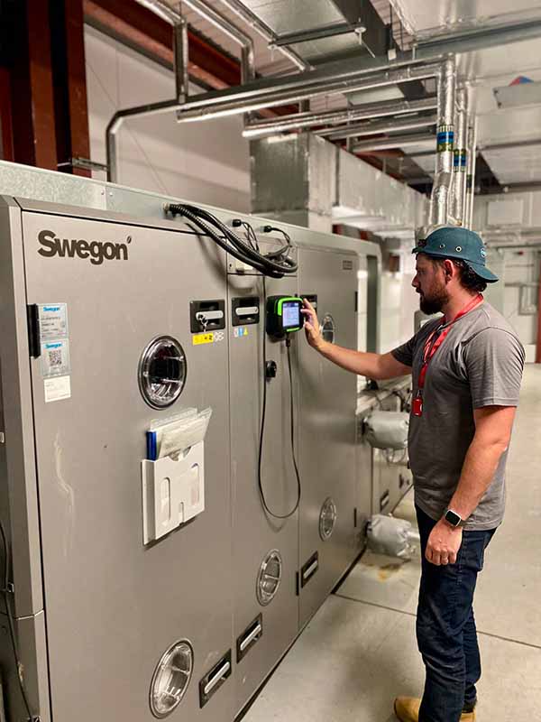 Adam Taylor performing AHU Maintenance